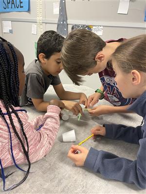 students conducting science experiment